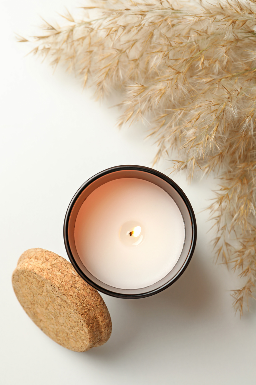 Scented Candle and Reed on White Background